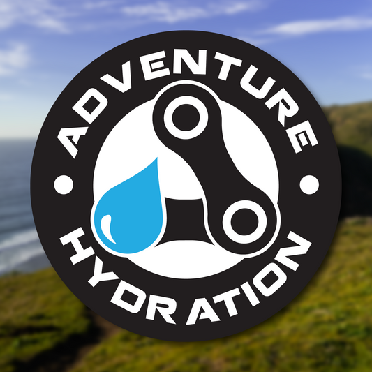 A graphic showing the Adventure Hydration Logo as a sticker with a photo from Point Reyes California in the background.